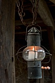 An old lantern with a candle as lighting on a terrace