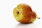 A Forelle pear lying on its side