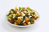 Vegetable salad with pineapple, chicken and feta