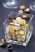 Shelled macadami nuts in a glass vase