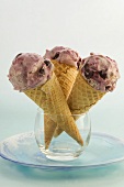 Three cones of blueberry ice cream