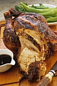 Marinated roast chicken, partly carved (China)
