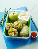 Wraps, apple and yoghurt in lunch box