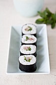 Maki sushi filled with tuna and Japanese spring onions