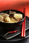 Seafood soup with mushrooms and noodles (Asia)