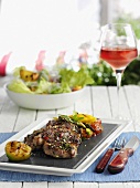 Entrecote and grilled vegetables, salad and rose wine
