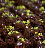Lots of brownies with pistachios