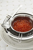 Chilled salmon caviar in a silver bowl