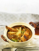 Arroz caldoso (rice stew, Spain) with rabbit, artichokes and saffron milk-cap