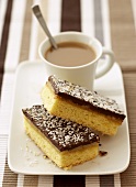 Two coconut slices with coffee
