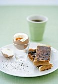 Hard-boiled breakfast egg and toast with Vegemite