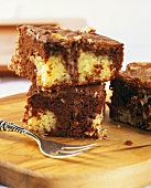Brownies with coconut flakes and chocolate icing