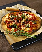 Pizza with bacon, mushrooms and rosemary on pizza tray