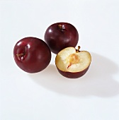 Three dark-coloured plums (Turkey)