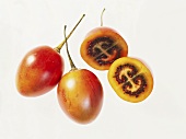 Two whole and two half tamarillos