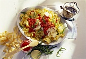 Ribbon pasta with rocket, tomato sauce & Parmesan shavings