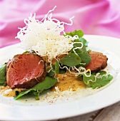 Beef fillet with deep-fried glass noodles and salad
