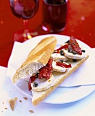 Goat's cheese baguette with dried tomatoes and capers