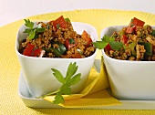 Minced beef with peppers in two china bowls