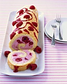 Raspberry roll, a piece cut