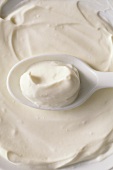 Yoghurt spread smoothly and on spoon
