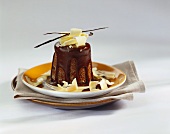 Chocolate pudding with chocolate sauce & white chocolate curls