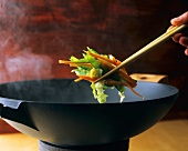 Chopsticks with vegetables from the wok