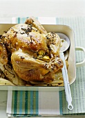 A roast chicken with lemon and fennel