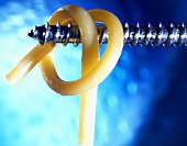 Macaroni hanging on a screw