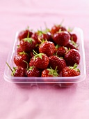 Fresh strawberries in a plastic tray