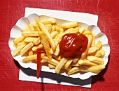 Chips with ketchup in a cardboard tray