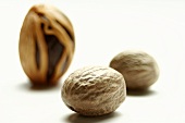 Three nutmegs, one unshelled