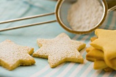 Biscuits with icing sugar in sieve
