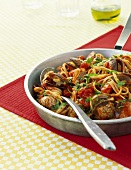 Ribbon pasta with mussels and tomato sauce