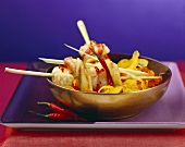 Chili shrimps skewered on lemon grass with peppers