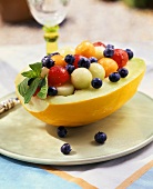 Melon and blueberry salad in half a honeydew melon