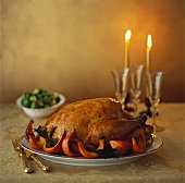 Roast turkey with pumpkin wedges; Brussels sprouts