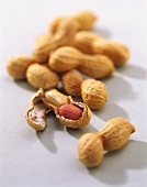 Several peanuts, one opened