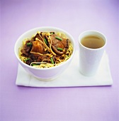 Egg noodles with mushrooms and chives; tea