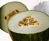 Musk melon (Cucumis melo), halved