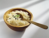 Sauerkraut in wooden bowl with spoon