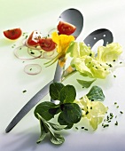 Salad ingredients with salad servers