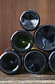 Sherry bottles, lying on their sides, view of bottom of bottles