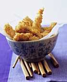 Breaded chicken pieces in Asian bowl