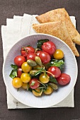 Cherry tomato and caper salad with puff pastries