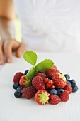 Assorted berries on white linen cloth