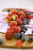 Mixed berries on chopping board