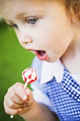 Small girl with lollipop