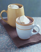 Two cups of cocoa with marshmallows