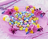 Easter plate with sugar eggs and spring flowers